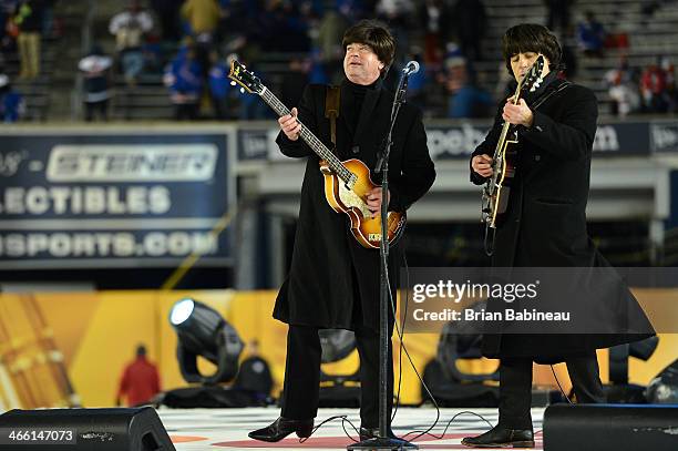 Billy J. Ray and John Korba of Strawberry Fields performs during the 2014 Coors Light NHL Stadium Series at Yankee Stadium on January 29, 2014 in the...