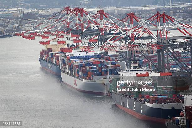 Container ships are docked in port as seen from the window of a Customs and Border Protection , Blackhawk helicopter ahead of Super Bowl XLVIII on...