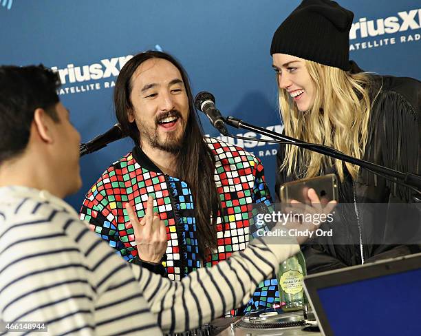 Steve Aoki and model Tiernan Cowling visit the SiriusXM Studios on March 13, 2015 in New York City.