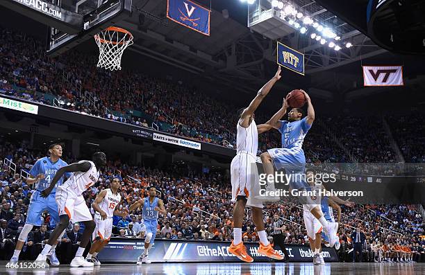 Marcus Paige of the North Carolina Tar Heels drives to the basket against the Virginia Cavaliers during the semifinals of the 2015 ACC Basketball...