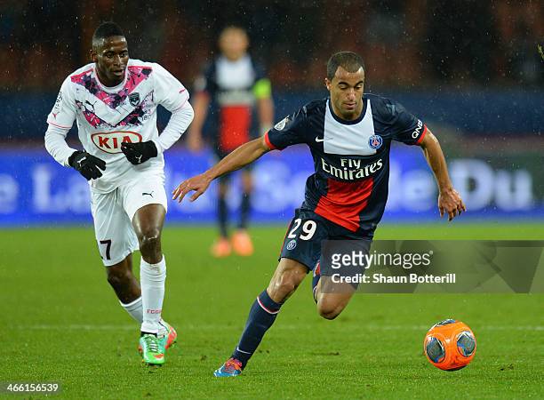 Lucas Rodrigues Da Silva of Paris Saint-Germain FC breaks away from Andre Biyogo Poko of Girondins de Bordeaux during the Ligue 1 match between Paris...