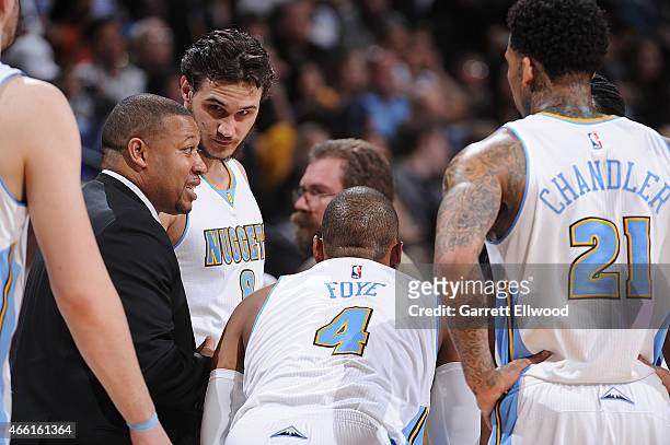 Head coach Melvin Hunt of the Denver Nuggets talks with his team during the game against the Golden State Warriors on March 13, 2015 at the Pepsi...