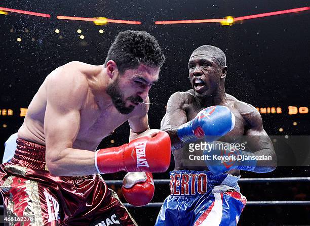 Andre Berto lands a punch against Josesito Lopez during their 12 round welterweight bout at Citizens Business Bank Arena March 13, 2015 in Ontario,...
