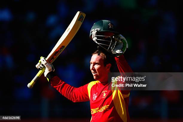 Brendan Taylor of Zimbabwe celebrates his century during the 2015 ICC Cricket World Cup match between India and Zimbabwe at Eden Park on March 14,...