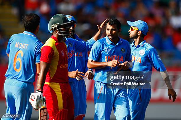 Mohammed Shami of India celebrates his wicket of Sikandar Raza of Zimbabwe during the 2015 ICC Cricket World Cup match between India and Zimbabwe at...