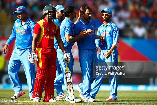 Mohammed Shami of India celebrates his wicket of Sikandar Raza of Zimbabwe during the 2015 ICC Cricket World Cup match between India and Zimbabwe at...