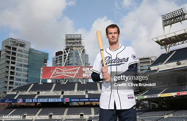 Andy Murray of Great Britain poses for a photograph in a San Diego Padres baseball kit after his straight sets victory against Donald Young of the...