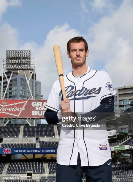 Andy Murray of Great Britain poses for a photograph in a San Diego Padres baseball kit after his straight sets victory against Donald Young of the...