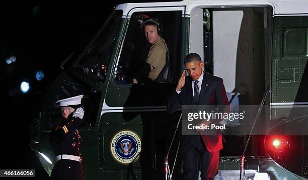 President Barack Obama returns at the White House after travelling to Los Angeles, and Phoenix Arizona, on March 13, 2015 in Washington DC,. The...