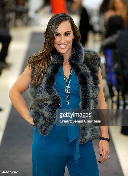 Danielle Conti walks the runway at the Saks Fifth Avenue And Off The Field Players' Wives Association Charitable Fashion Show on January 31, 2014 in...