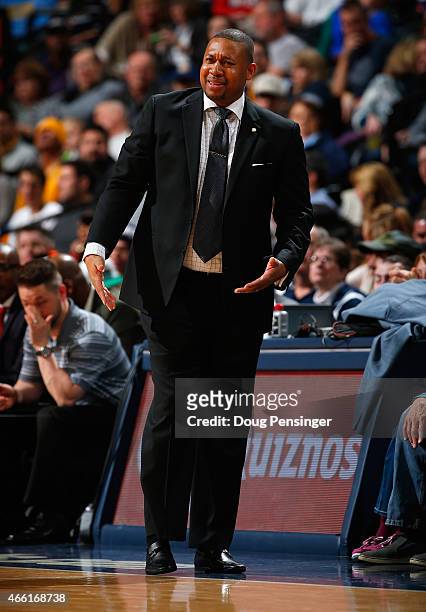 Interim head coach Melvin Hunt of the Denver Nuggets leads his team against the Golden State Warriors at Pepsi Center on March 13, 2015 in Denver,...