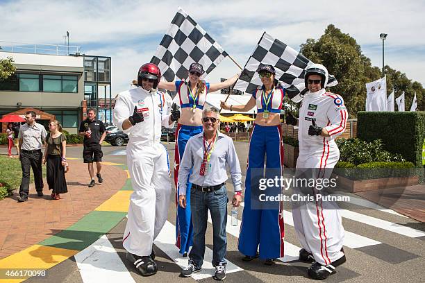 Mick Doohan poses with off track entertainment on day 3 of the 2015 Australian Formula 1 Grand Prix at Albert Park on March 14, 2015 in Melbourne,...