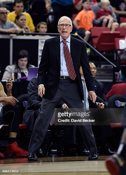 Head coach Steve Fisher of the San Diego State Aztecs calls to his team during a semifinal game of the Mountain West Conference basketball tournament...