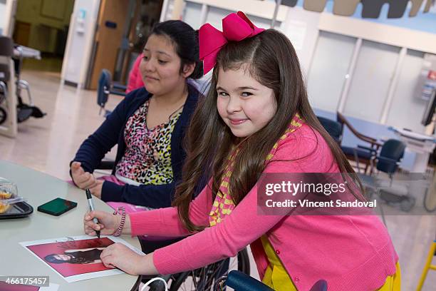 Actress Addison Riecke visits and brings gifts to patients at the Pediatric Rehabilitative Medicine Unit at Children's Hospital Los Angeles on...