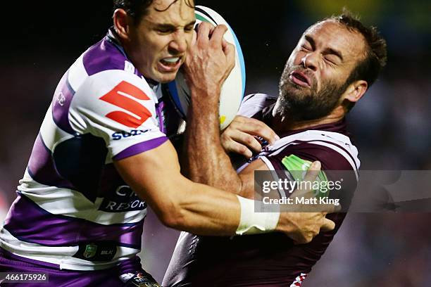 Brett Stewart of the Sea Eagles is tackled by Billy Slater of the Storm during the round two NRL match between the Manly Warringah Sea Eagles and the...
