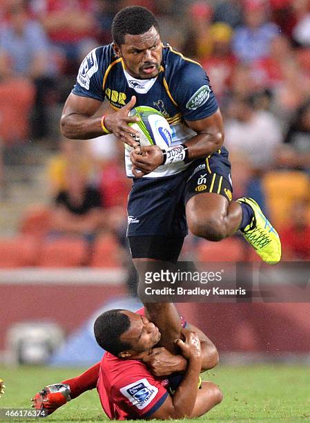 Henry Speight of the Brumbies skips out of the tackle by Will Genia of the Reds during the round five Super Rugby match between the Reds and the...