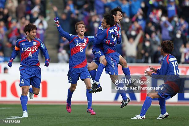 Shohei Abe of Ventforet Kofu celebrates scoring his team's first goal with his teammates during the J.League match between Ventforet Kofu and Nagoya...