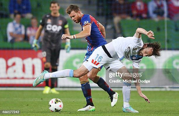 Daniel Mullen of the Jets and Joshua Kennedy of Melbourne City compete for the ball during the round 21 A-League match between Melbourne City FC and...