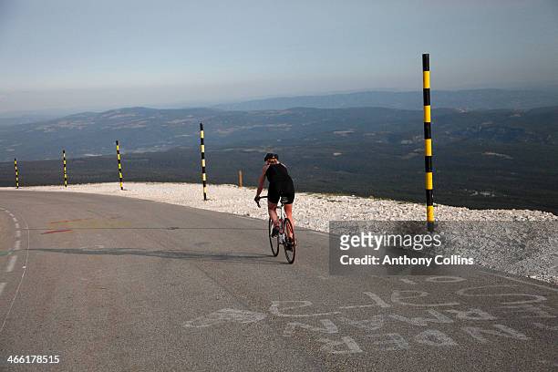 amateur female cyclist riding back down mont vento - tour de france stock pictures, royalty-free photos & images
