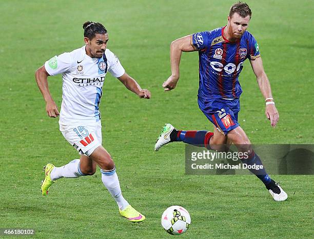 David Williams of Melbourne City competes for the ball for goal with Daniel Mullen of the Jets during the round 21 A-League match between Melbourne...