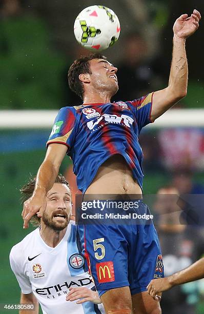 Ben Kantarovski of the Jets heads the ball away from Joshua Kennedy of Melbourne City during the round 21 A-League match between Melbourne City FC...
