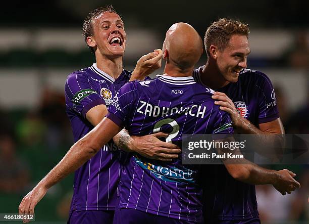 Ruben Zadkovich of the Glory is congratulated by Michael Thwaite and Rostyn Griffiths after scoring an equalising goal during the round 21 A-League...