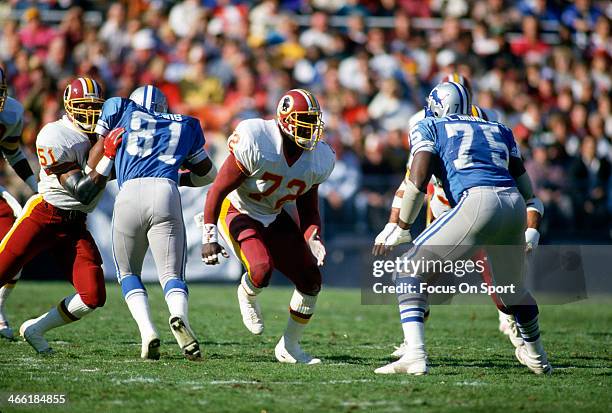 Dexter Manley of the Washington Redskins rushes up against Lomas Brown of the Detroit Lions during an NFL football game November 15, 1987 at RFK...