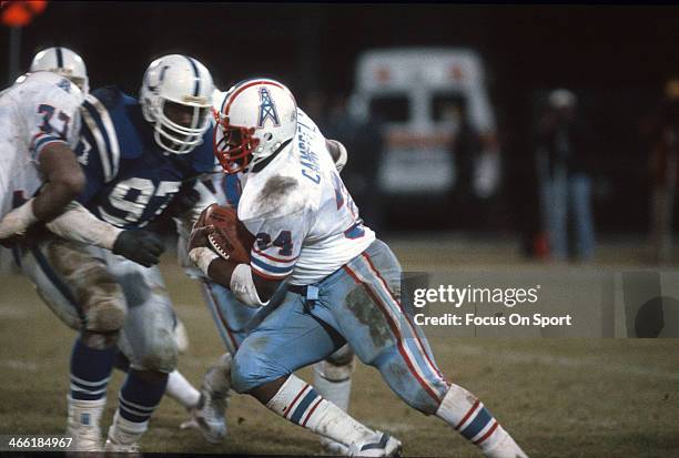 Running Back Earl Campbell of the Houston Oilers carries the ball against the Baltimore Colts during an NFL football game December 18, 1983 at...