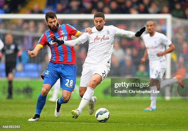 Joe Ledley of Crystal Palace challenges Adel Taarabt of QPR during the Barclays Premier League match between Crystal Palace and Queens Park Rangers...