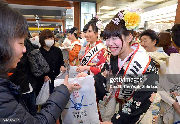 New Hokuriku Shinkansen bullet train passengers receive gifts upon arrival at Kanazawa Station as new Hokuriku Shinkansen bullet train launches on...