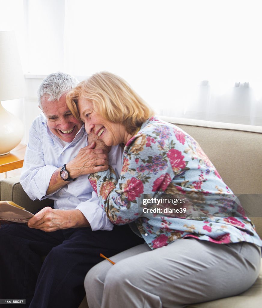 Elderly couple laughing together