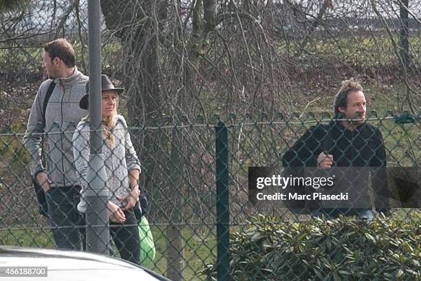 French Olympic champion swimmer Alain Bernard and french-Swiss snowboarder Anne-Flore Marxer arrive at Honours Pavilion at Charles-de-Gaulle airport...