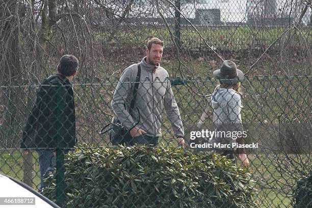 French Olympic champion swimmer Alain Bernard and french-Swiss snowboarder Anne-Flore Marxer arrive at Honours Pavilion at Charles-de-Gaulle airport...