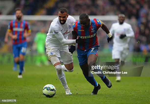 Yannick Bolasie of Crystal Palace takes on Sandro of QPR during the Barclays Premier League match between Crystal Palace and Queens Park Rangers at...