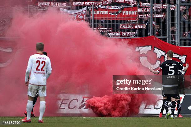 Pyrotechnics by the Fans of Cottbus during the Third League match between Hallescher FC and FC Energie Cottbus at Erdgas-Sportpark on March 14, 2015...