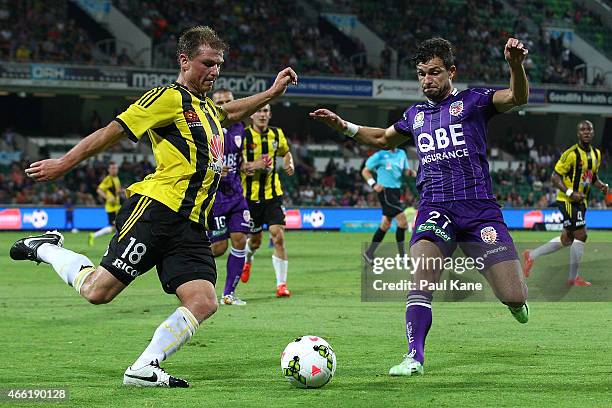 Ben Sigmund of the Phoenix and Dragan Paljic of the Glory contest for the ball during the round 21 A-League match between the Perth Glory and the...