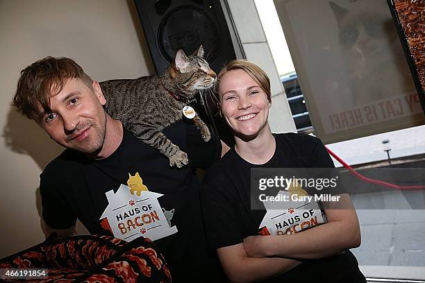 Mick Szydlowski, Oskar the Blind Cat and Bethany Szydlowski attend South by Southwest at Haus of Bacon on March 13, 2015 in Austin, Texas.