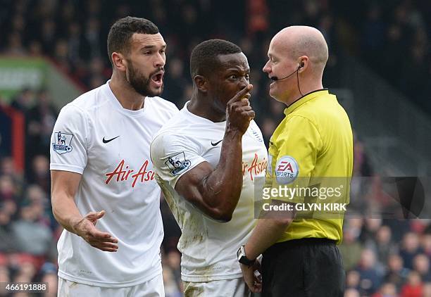 Queens Park Rangers' English defender Nedum Onuoha argues with the referee during the English Premier League football match between Crystal Palace...