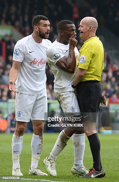 Queens Park Rangers' English defender Nedum Onuoha argues with the referee during the English Premier League football match between Crystal Palace...