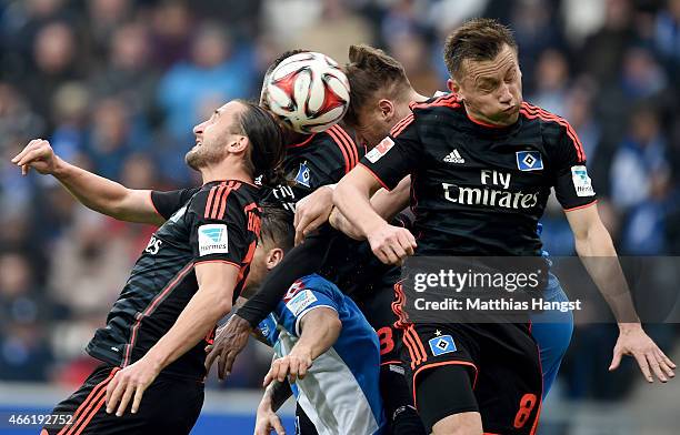 Petr Jiracek of Hamburg, Eugen Polanski of Hoffenheim, Cleber of Hamburg, Ermin Bicakcic of Hoffenheim and Ivica Olic of Hamburg jump for a header...