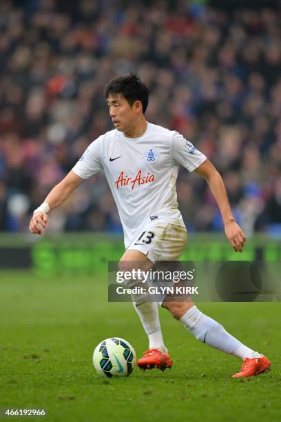 Queens Park Rangers' Korean defender Yun Suk-young plays the ball during the English Premier League football match between Crystal Palace and Queens...