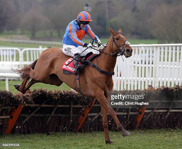 Tony McCoy riding Beg To Differ clears the last hurdle to win the race during the Betfred "Home of Goals Galore" Handicap Hurdle Race at Uttoxeter...
