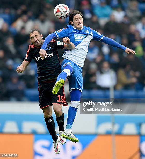 Petr Jiracek of Hamburg jumps for a header with Sebastian Rudy of Hoffenheim during the Bundesliga match between 1899 Hoffenheim and Hamburger SV at...