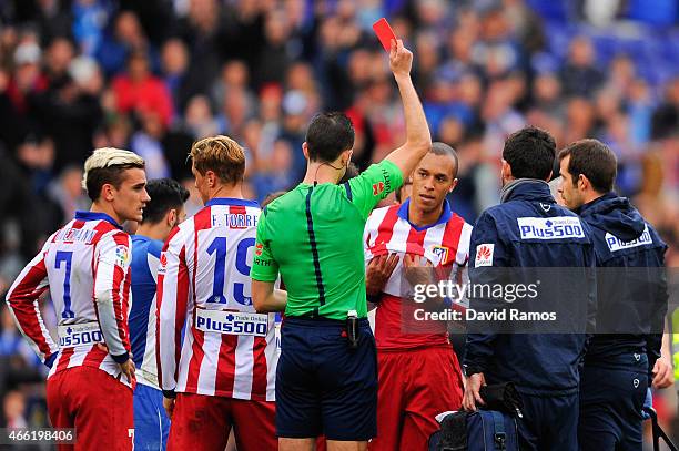 Joao Miranda of Atletico de Madrid is shown a red card for a challenge on Abraham Gonzalez of RCD Espanyol during the La Liga match between RCD...