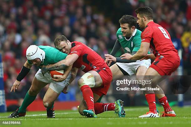 Jamie Roberts of Wales tackles Rory Best of Ireland during the RBS Six Nations match between Wales and Ireland at the Millennium Stadium on March 14,...