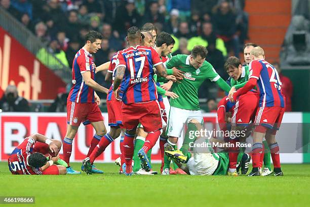 Philipp Bargfrede of Bremen reacts after a attack between Medhi Benatia of Muenchen and Sebastian Proedl of Bremen during the Bundesliga match...