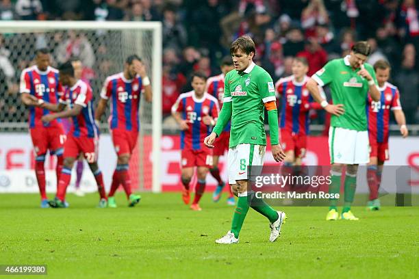 Clemens Fritz of Bremen and his team mate Sebastian Proedl reacts during the Bundesliga match between SV Werder Bremen and FC Bayern Muenchen at...