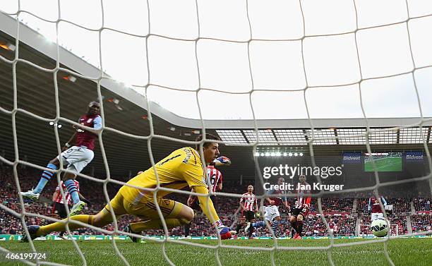Gabriel Agbonlahor of Aston Villa scores their second goal past Costel Pantilimon of Sunderland during the Barclays Premier League match between...