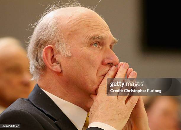 Liberal Democrat business secretary Vince Cable listens to a speaker during the party's spring conference at the ACC on March 14, 2015 in Liverpool,...