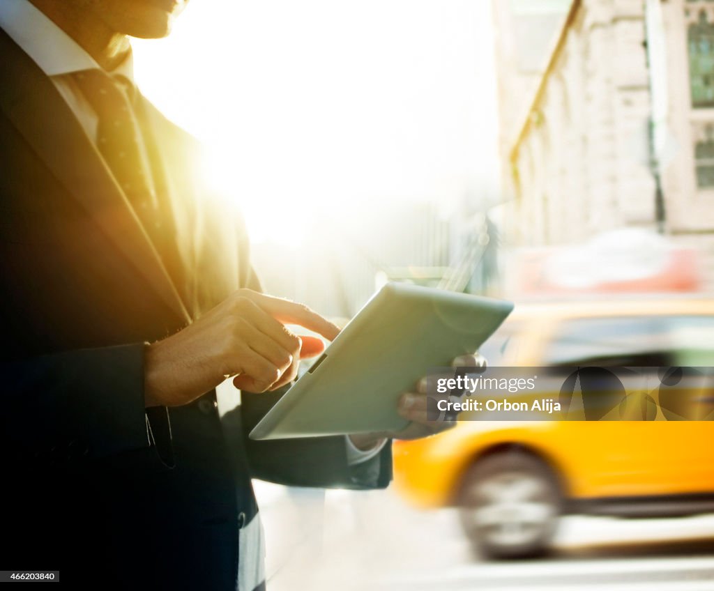 Businessman using digital tablet in New York